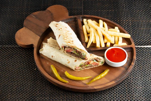 Meat doner in flatbread served with french fries ketchup and pickled pepper — Stock Photo, Image