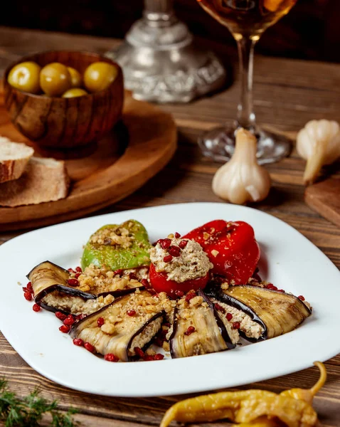 eggplant tomatoes and belly pepper on the table