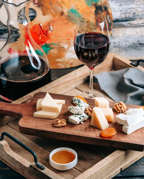 Cheese plate with red wine _ — Stockfoto