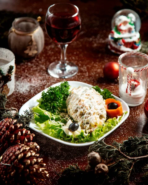 Russian salad with herbs and glass of wine — Stock Photo, Image