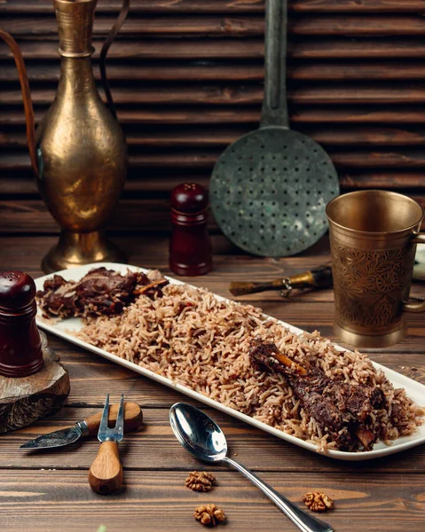 Fried meat with rice in sauce — Stock Photo, Image