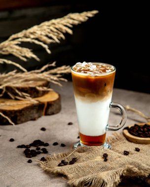 three layered iced coffee served in glass