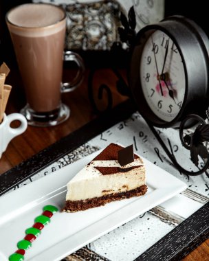 chocolade cake with hot chocolade on the table