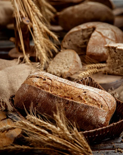 Organic whole grain bread decorated with grain ears — Stock Photo, Image