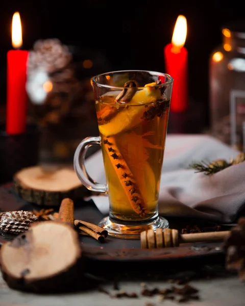 Tea with cinnamon stick, orange and cloves — Stock Photo, Image