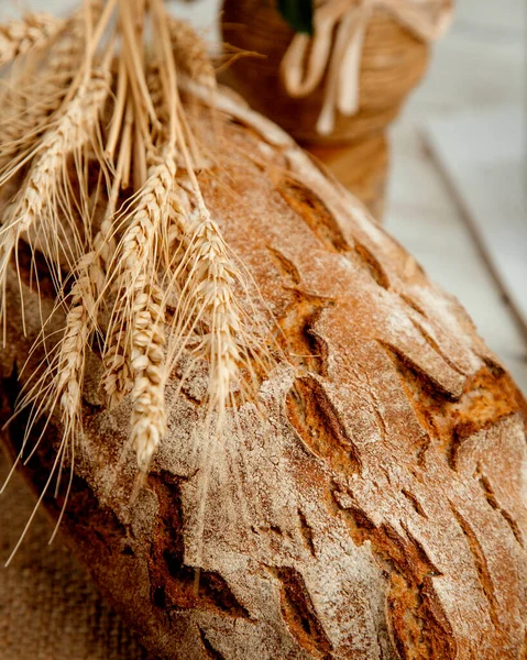 Loaf of bread with  wheat branch — Stock Photo, Image