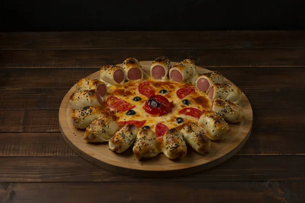 sausage roll pizza with sausage, olive tomato and cheese