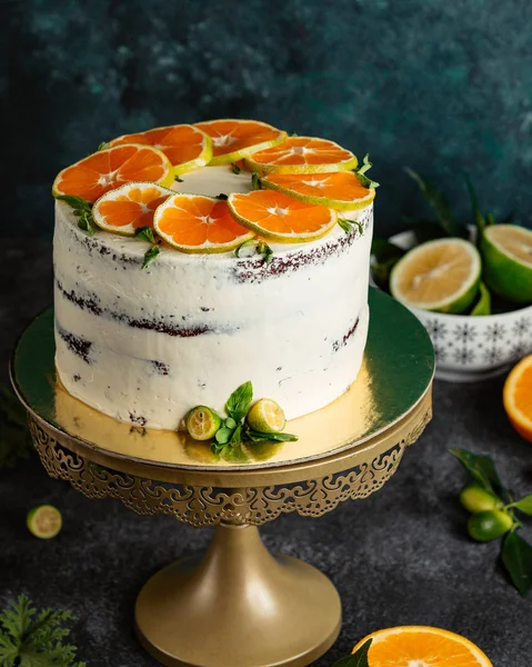 Naked cake with orange slices on top — Stock Photo, Image