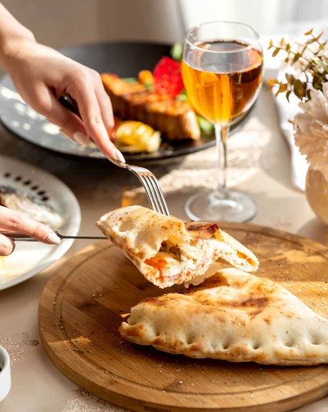 Half -cut stuffed pie with salami cheese tomato sauce and mushroom Stock Image