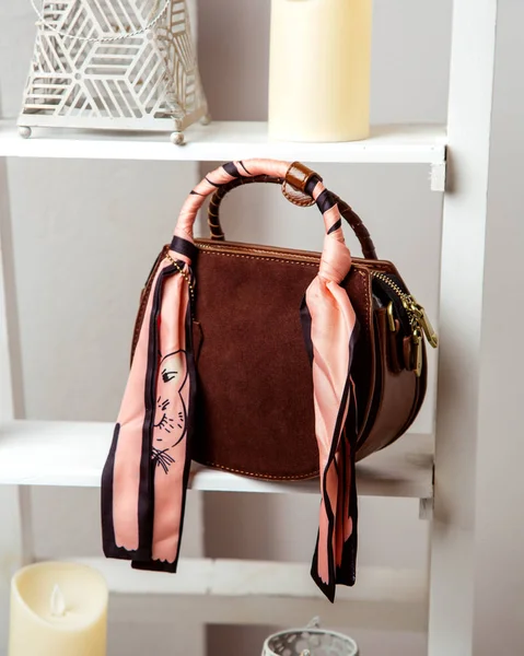 Burgundy bag in suede and leather with scarf on handle — Stock Photo, Image