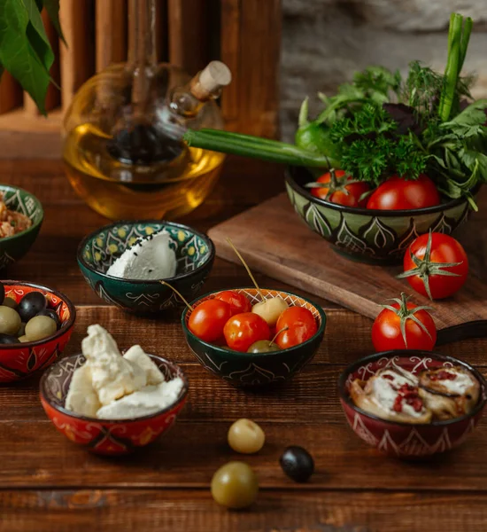 Side dishes for lunch in small bowls with traditional patterns — Stock Photo, Image