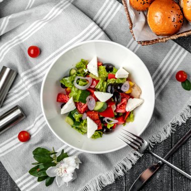 greek salad on the table ___