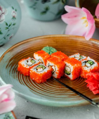 sushi set with red caviar on the table _