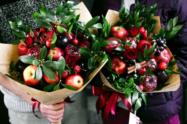 fruit bouquet with various fruits and flowers