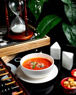 tomato soup with side crackers and cheese _