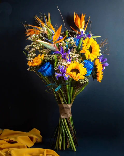 bouquet of bouquet of iris  sunflowers and blue roses