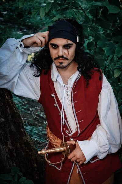 Portrait of man in a pirate costume poses outdoor. — Stock Photo, Image