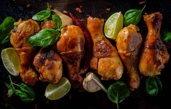 Grilled bbq spicy chicken legs on a metallic background. Top vie