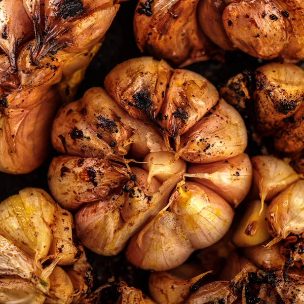 Macro shot of baked garlic cloves. — Stock Photo, Image