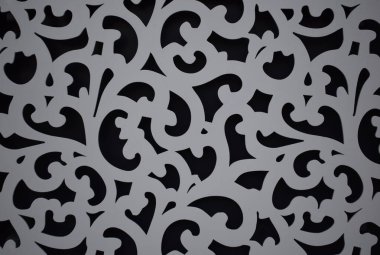 Siyah arka planda gri kıvrımlı desen. Çizgiler