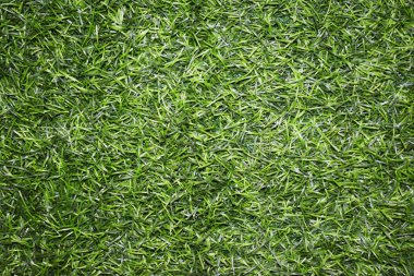 artificial grass . Bright saturated green turf texture. pile