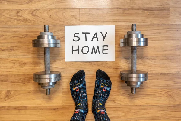 Home fitness with dumbbells in selfisolation