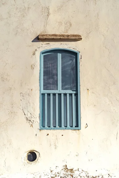 white wall with carpets wall in a city in North Africa