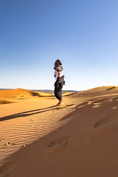 a girl in the Sahara desert in North Africa