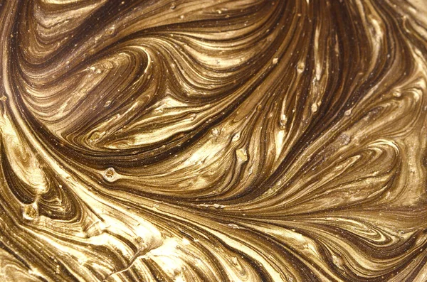 Marble background with golden powder.