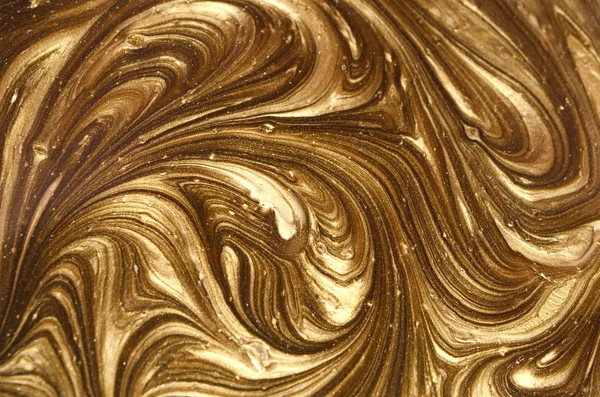 Marble background with golden powder.