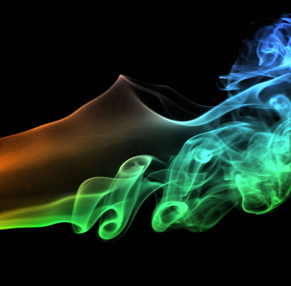 Swirling smoke from the incense on a homogeneous background
