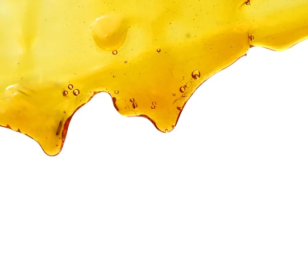 Närbild Droppande Söt Välsmakande Honung Isolerad Vitt — Stockfoto