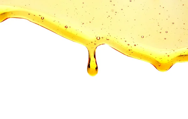 Sweet Honey Gieten Geïsoleerd Een Witte Achtergrond Honing Vloeibaar Getextureerde — Stockfoto