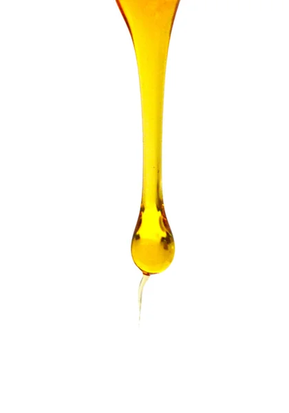 Sweet Honey Hälla Isolerad Vit Bakgrund Honung Flytande Texturerat Droppe — Stockfoto