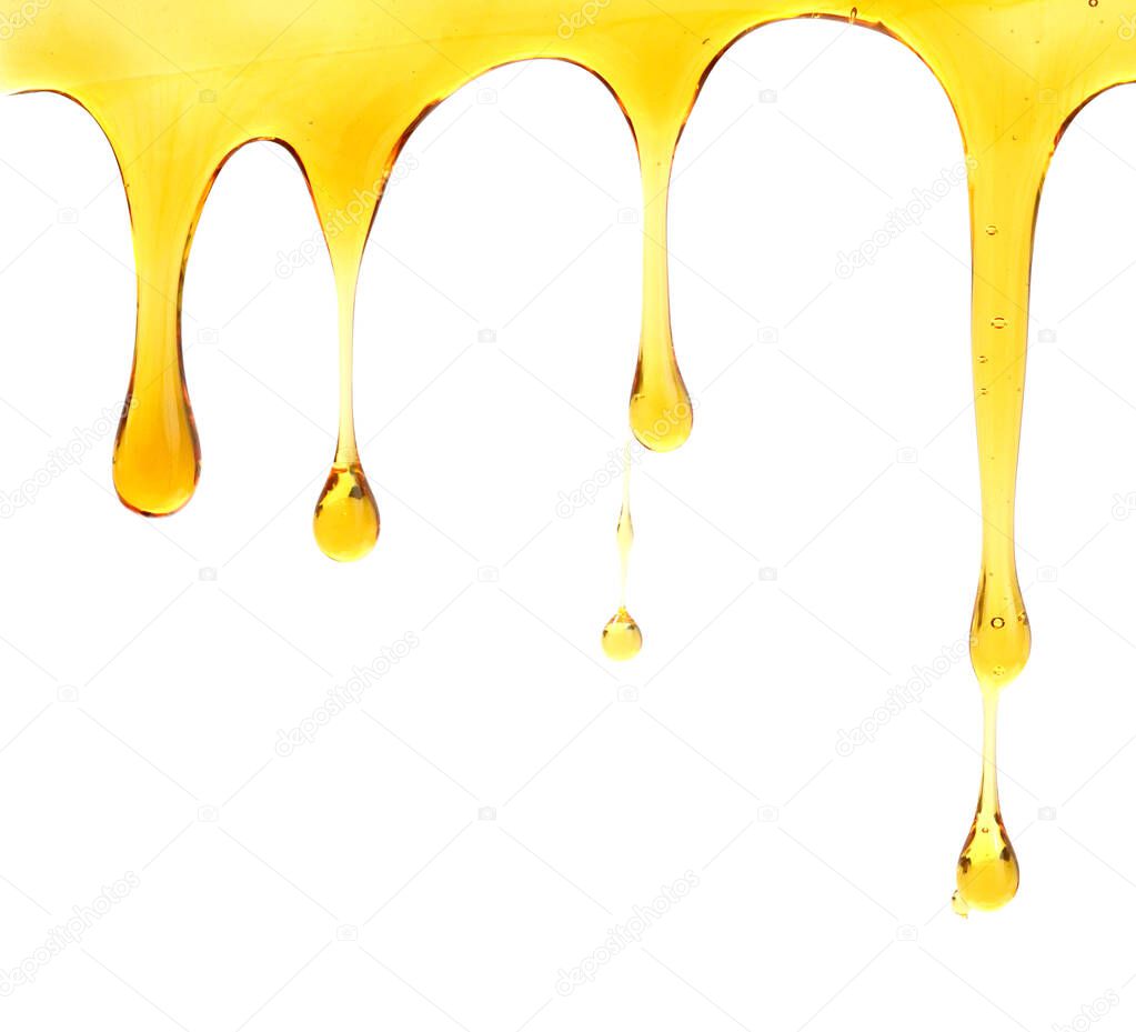 Pouring natural transparent honey isolated on white background 