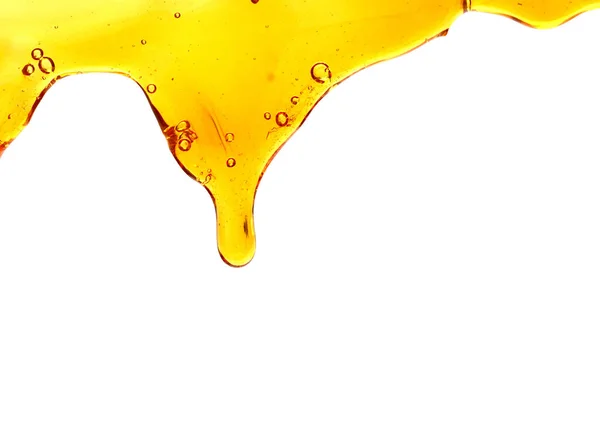 Sweet Honey Odlewania Izolowana Białym Tle Miód Płynny Teksturowanej Drop — Zdjęcie stockowe