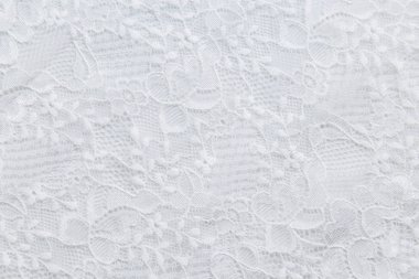 küçük çiçekli beyaz zemin üzerine beyaz dantel.