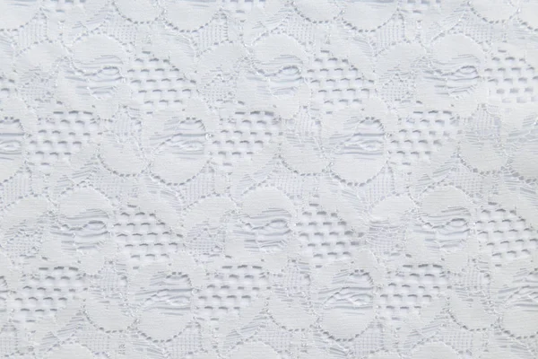 küçük çiçekli beyaz zemin üzerine beyaz dantel.