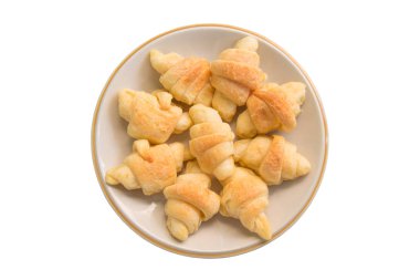 Beyaz arka plan üzerinde izole plaka Mini kruvasan.