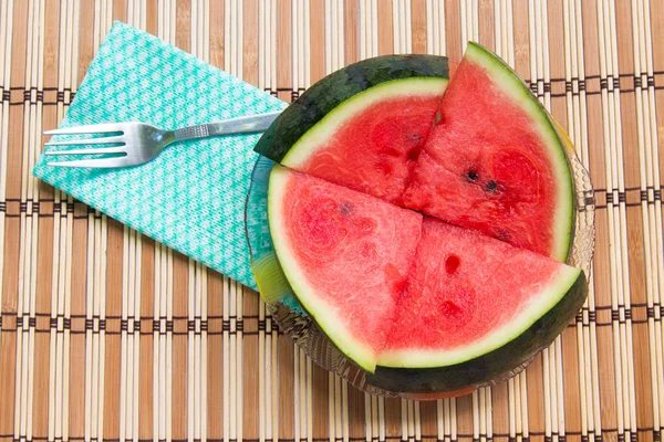 Watermelon slices on a plate on wood background. — Stock Photo, Image