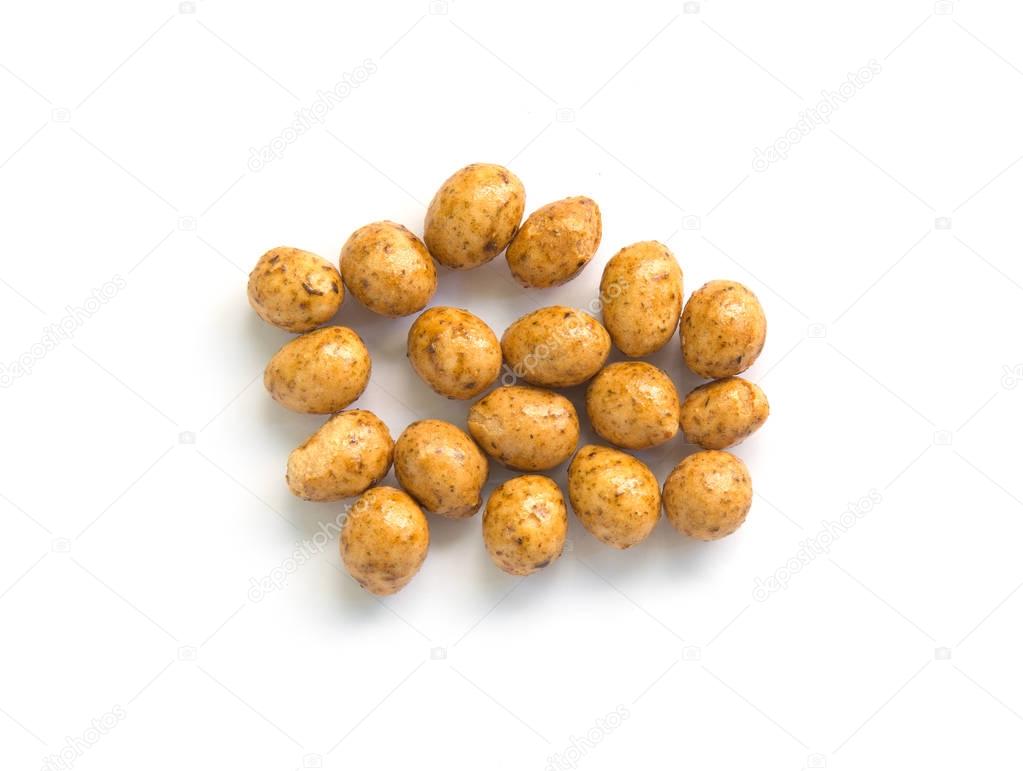 Roasted peanuts coated isolated on white background.