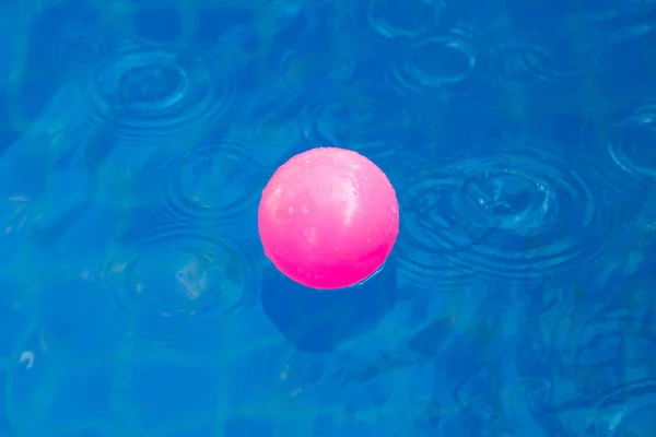 Pink plastic ball in pool , pool villa house. — Stock Photo, Image