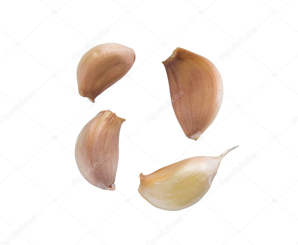 Fresh garlic cloves isolated on white background.