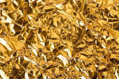 Altın buruşuk folyo kağıt doku arka plan.