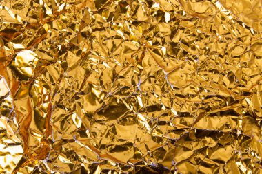 Altın buruşuk folyo kağıt doku arka plan.