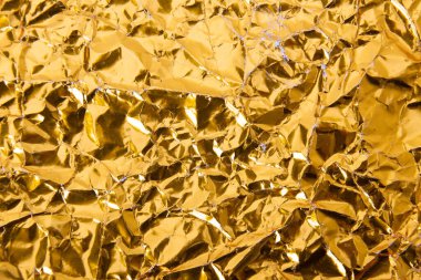 Altın buruşuk folyo kağıt doku arka plan.