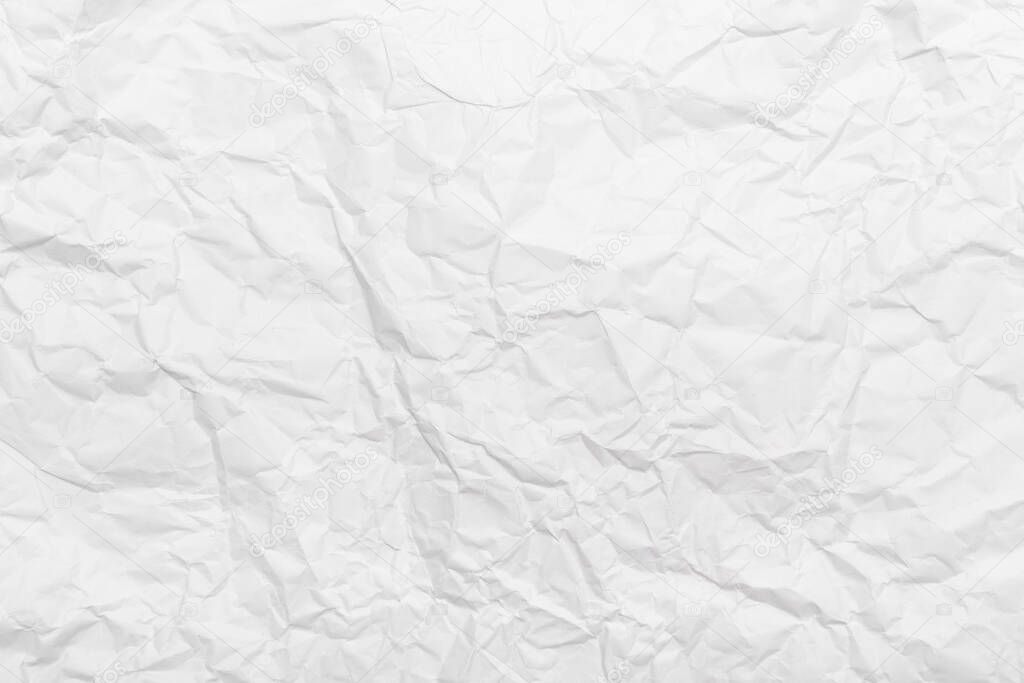 White crumpled paper texture background.