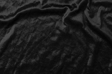 Soyut siyah kumaş kumaş dokusu arka plan veya sıvı dalga veya dalgalı kıvrımlar.