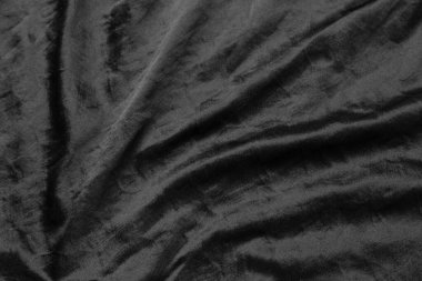 Soyut siyah kumaş kumaş dokusu arka plan veya sıvı dalga veya dalgalı kıvrımlar.