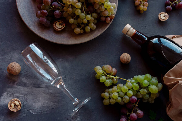 Romantic dinner red wine and grapes top view